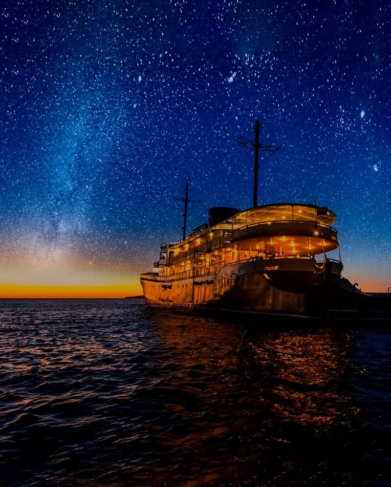 Starry night sky above the Evolution Yacht in the Galapagos